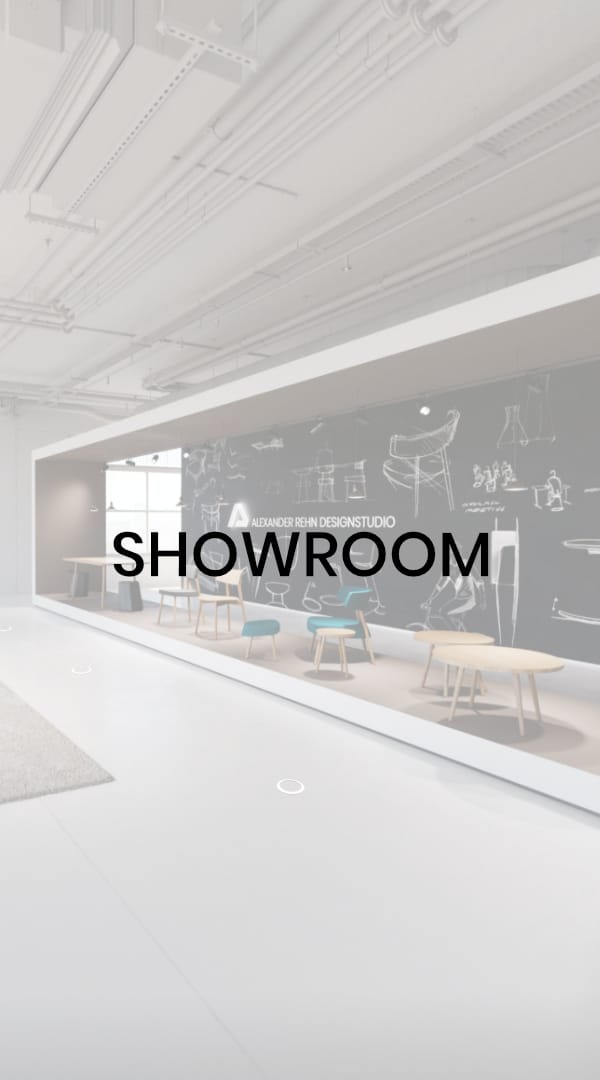 Virtual showroom by Designstudio Alexander Rehn with furniture on an elevated platform and sketches on a dark board in the background