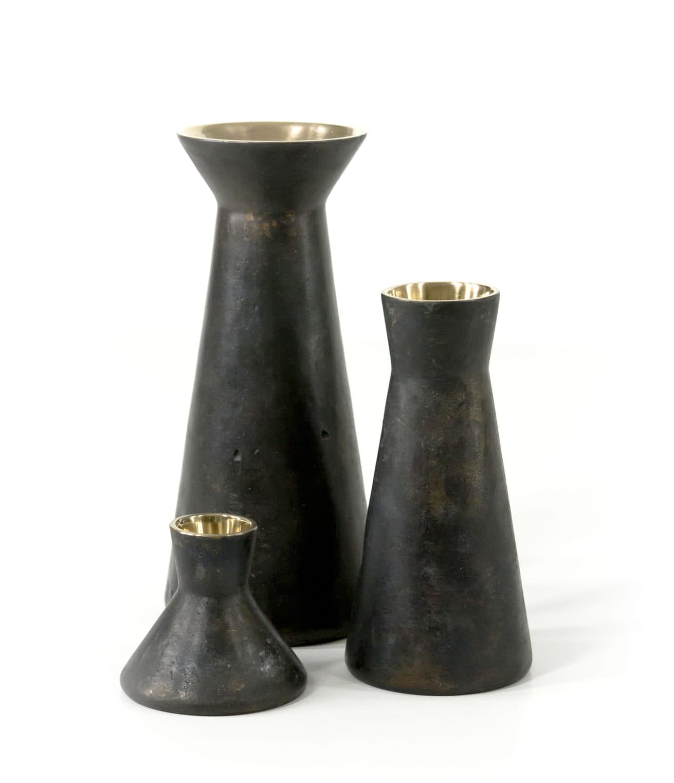 Three Y-01 vases in three sizes in simple tapered shape with collar on top made of bronze. Inside surface is gold and shiny and outside dark and matt