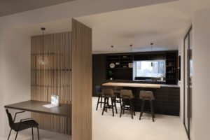 Apartment R1 visualization of modern furnished kitchen with wooden wall paneling, dark kitchen with bar stools