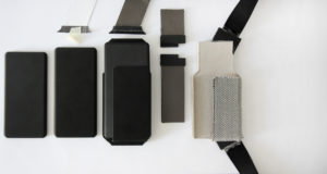 Models of Nest of Galaxy carrying strap and cover in simple and geometric shapes for transporting smartphones made of cardboard and fabrics.