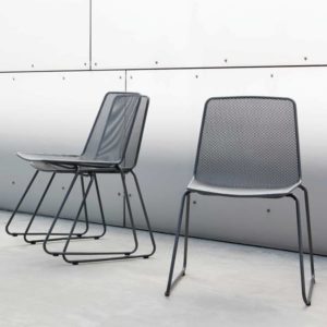 Haley Chairs with base in bent steel tube and seat and backrest in steel mesh in dark colors. One free standing chair and two stacked chairs.
