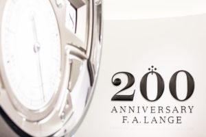 A. Lange und Söhne anniversary in three-dimensional font with clock in background