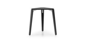 Finn Chair stool in geometric triangular shape with special placement of the legs that generates a distance from the seat