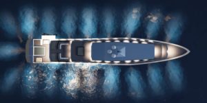 Top view of yacht in modern minimalist design at night with light beams into surrounding water and on deck
