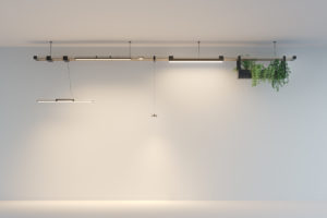 Pohlcon SystemPlus pendant luminaires with cooling fins hang from the ceiling in a bright room