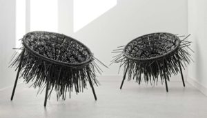 Two Oricio armchairs made of interwoven cable ties with wild spiky structure in light room