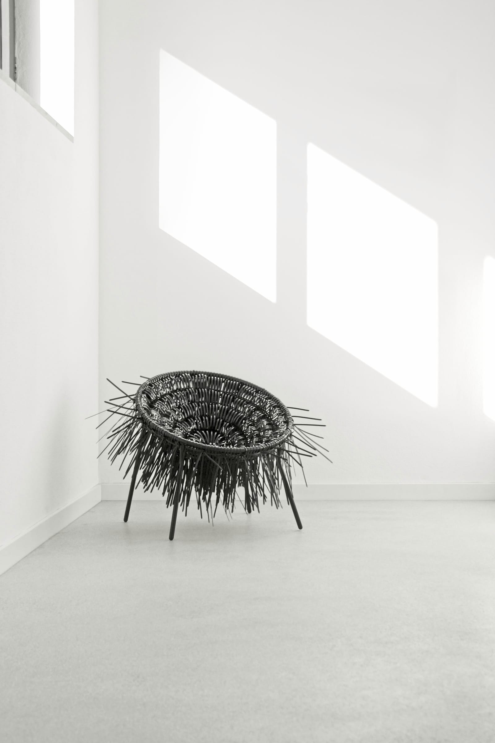 Oricio armchair made of interwoven zip ties is part of the design studio projects